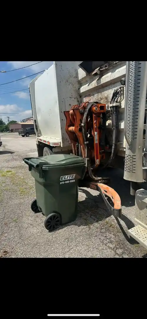 Commercial dumpster behind an office in Kentucky, ready for pickup by Elite Waste Services