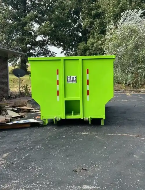 Elite Waste Services roll-off container at a Kentucky home renovation site